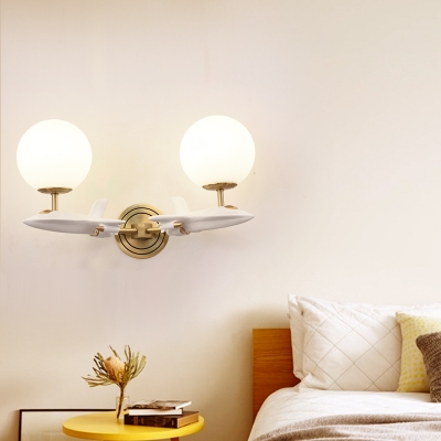 Cartoon Airplane Wall Lamp Resin 1/2-Head Bedside Wall Sconce in White and Gold with Ball Milk Glass Shade