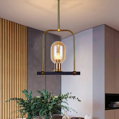 1 Light Dining Room Hanging Light Modern Black and Gold Pendulum Lamp with Oval Amber Glass Shade