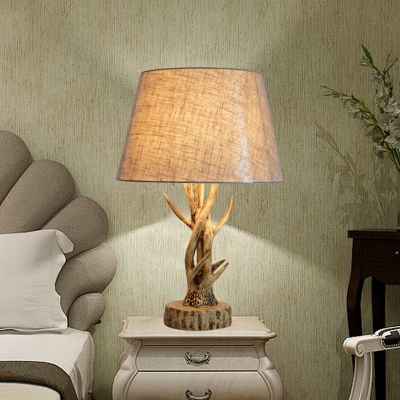 Beige Tapered Drum Table Light Countryside Fabric 1 Bulb Bedside Nightstand Lamp with Resin Antler Design