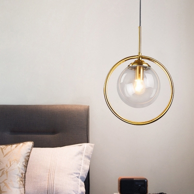 Ball Shaped Bedroom Pendant Light Clear/Smoke Grey/Amber Glass 1-Light Postmodern Hanging Lamp with Decorative Ring in Brass