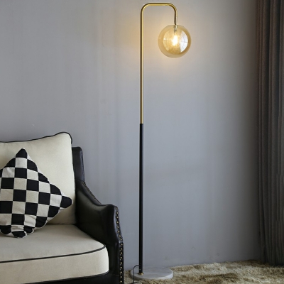 Spherical Amber Glass Floor Light Postmodern 1-Light Black-Brass Standing Light with Marble Base