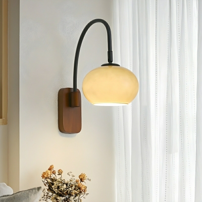 Modern Metal Wall Sconce with Transparent Glass Shade for Bedroom