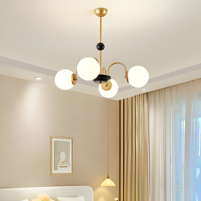 Glowing Gold Globe Chandelier with White Glass Shades and Modern Style
