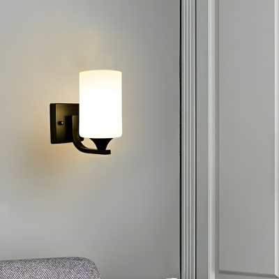 Modern Metal Hardwired Wall Sconce with Sleek Black Finish and Clear Glass Shade