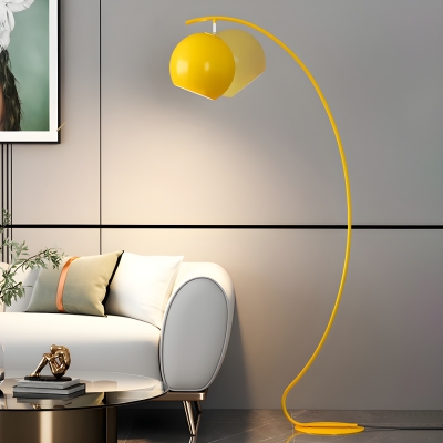 Yellow Arc Floor Lamp with Beige Globe Shade for Modern Style Interiors