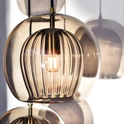 Industrial Clear Glass Pendant with Adjustable Cord Mounting for Contemporary Residential Use