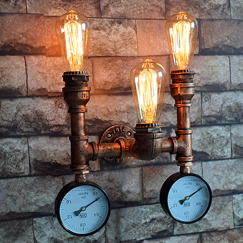 

Novel Industrial Three Light Indoor Pipe Sconce with Gauge Accent